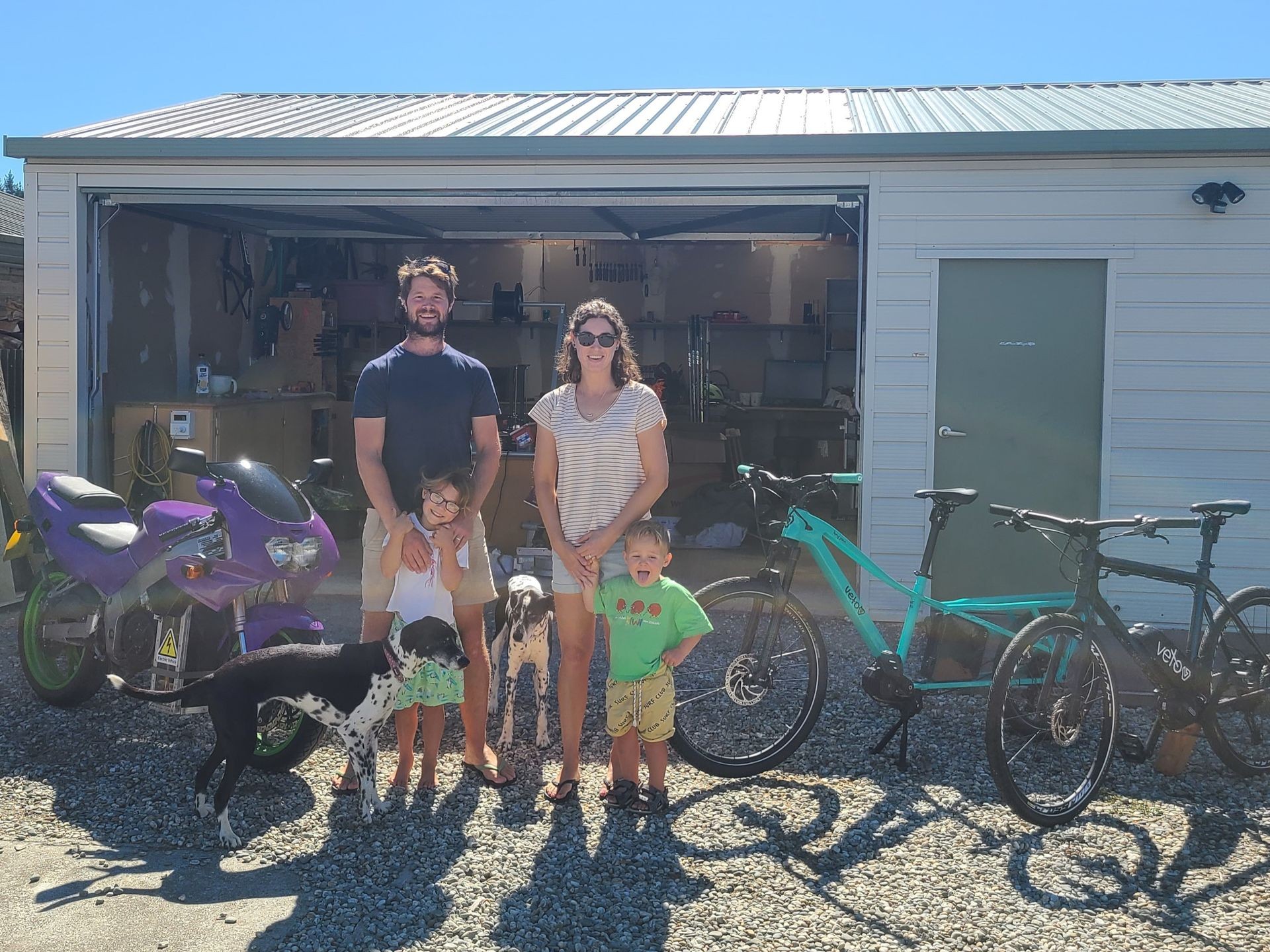 Family in front of the Veto workshop in Alexandra, New Zealand