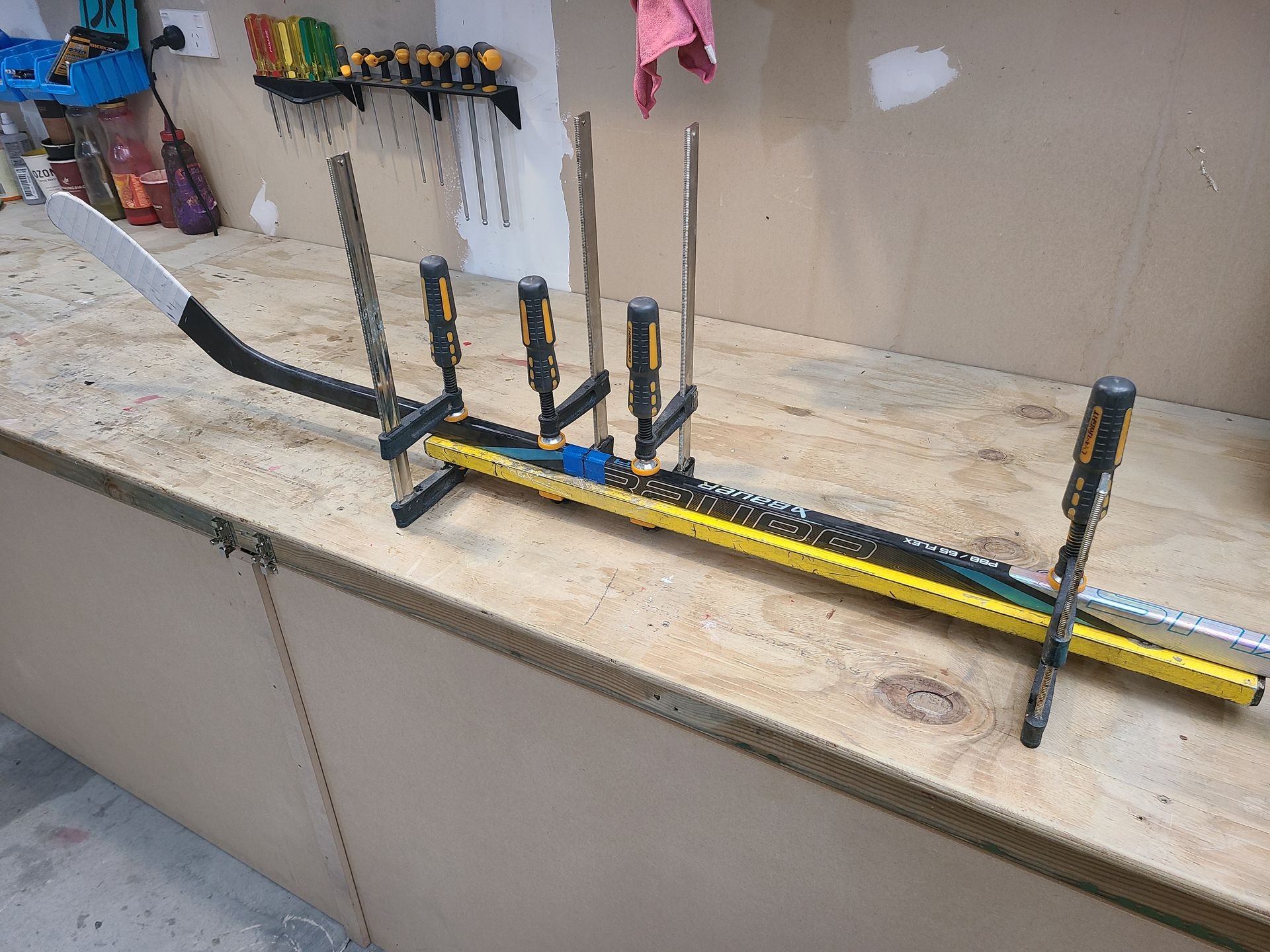 Ice hockey stick being repaired